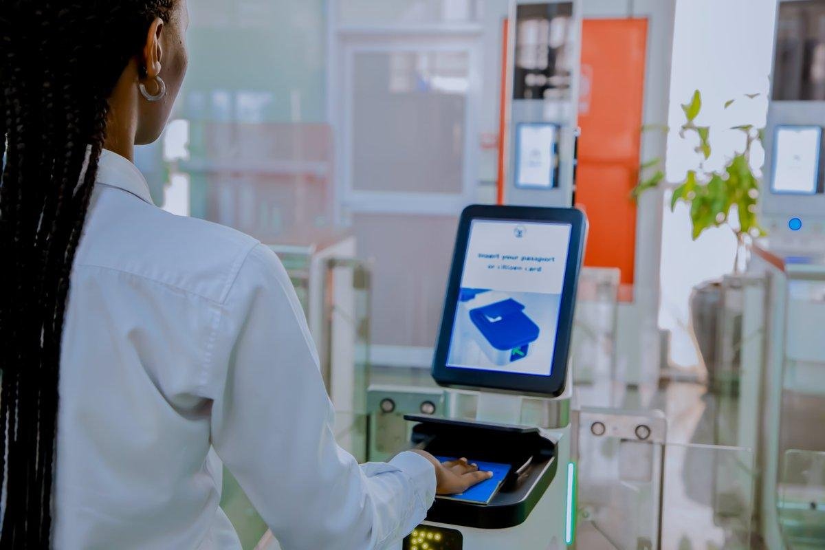 A traveller uses a self-service biometric passport gate