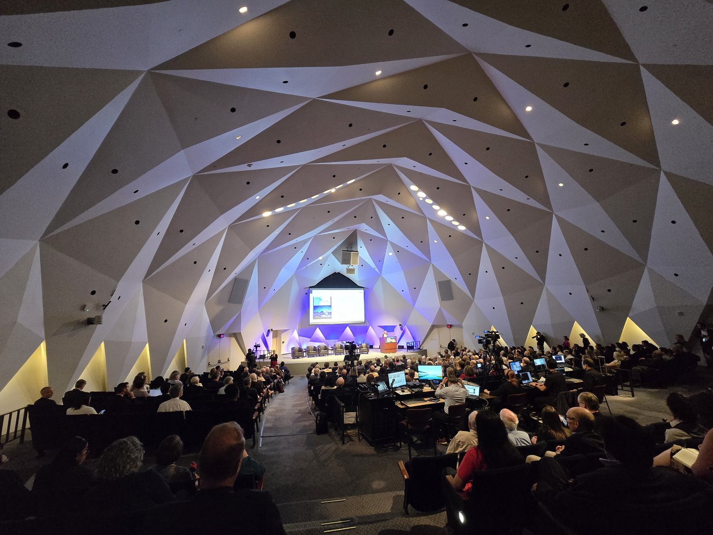 A packed auditorium during a public policy convening