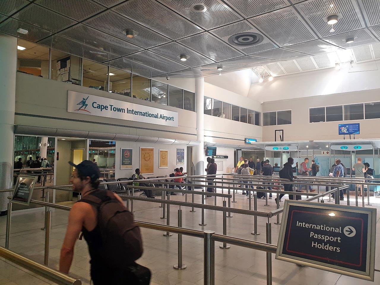Travellers move through the international arrivals hall at Cape Town International Airport
